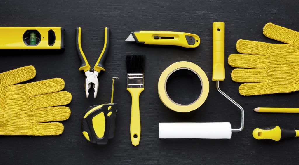 Arrangement yellow repair kit construction gloves