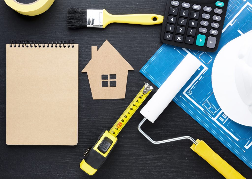 Blue print house with tools empty notepad