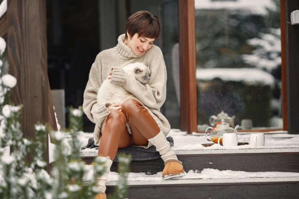 Outdoor photo of cozy female on the terrace