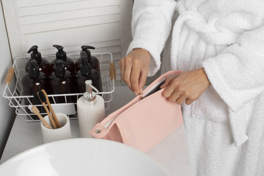 High angle adult holding toilet bag