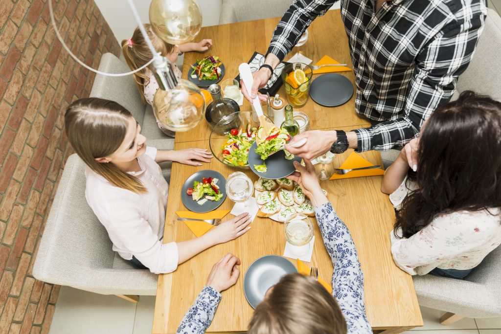 Man putting tasty dish plate