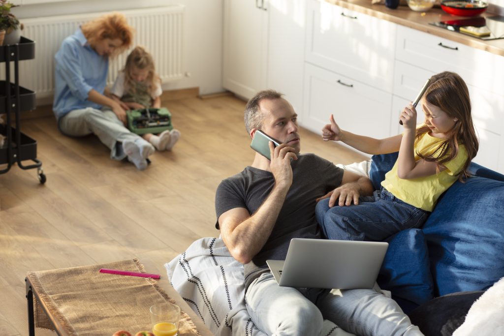 Parent trying work from home surrounded by kids