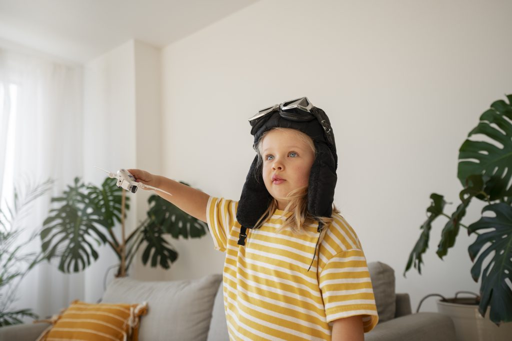 Girl wearing flying goggles medium shot