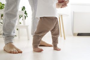 Cute baby going their first steps