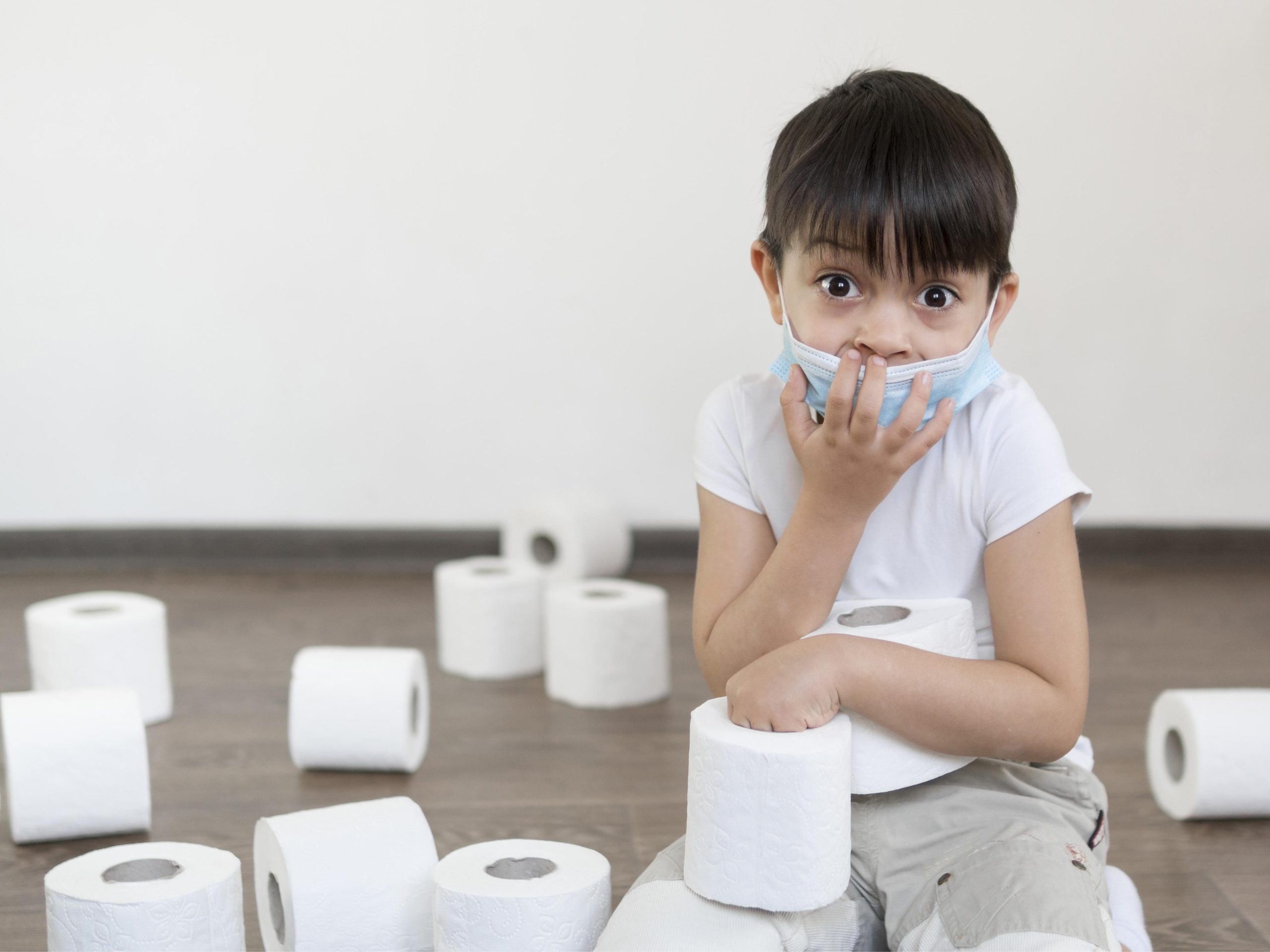 Boy playing with toilet paper